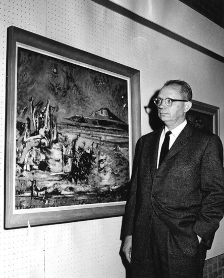Early image of Everett Spruce at an exhibition of his work
