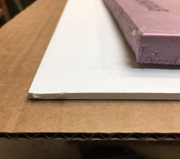 Illustrated are three materials that will work as separators when stacking artworks. The top is 3/4 inch foam insulation board, the middle is foam core, and the bottom is fluted cardboard.