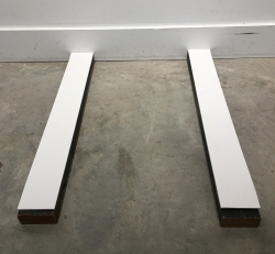 This shows two strips of foam core placed on top of the 2x4 risers. If used, they will help protect fragile frame finishes from damage while in the stack.