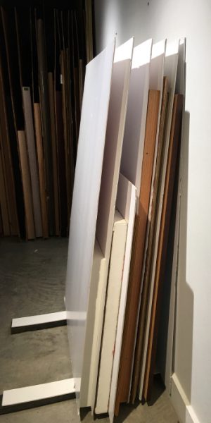 This shows artworks stacked with separators between each work. This provides the most protection for each unwrapped artwork in the stack. Note that the third separator from the end of the stack is sideways to properly cover the artwork behind it.