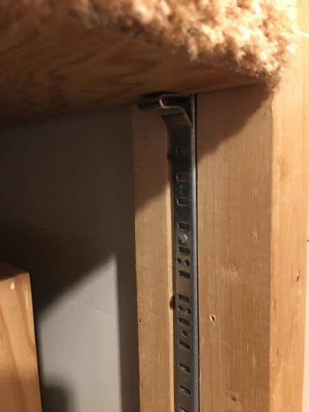 This image shows how 2 x 4 supports were routed so KV clip rails fit flush allowing the shelves to do the same.