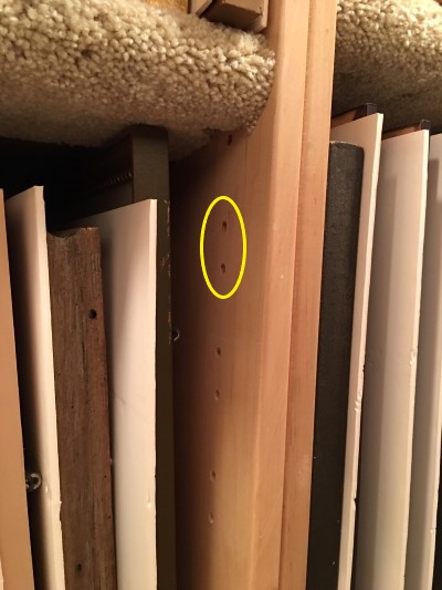 This image shows where holes are drilled into the sides of the box for the shelf support pegs.