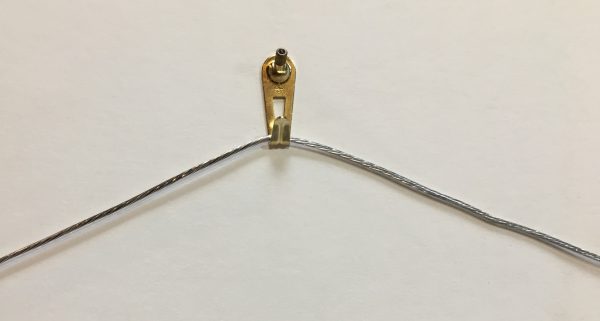 Image showing how a wire looks when hung by single hook.