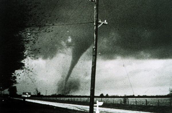 Tornado crossing a farm field.